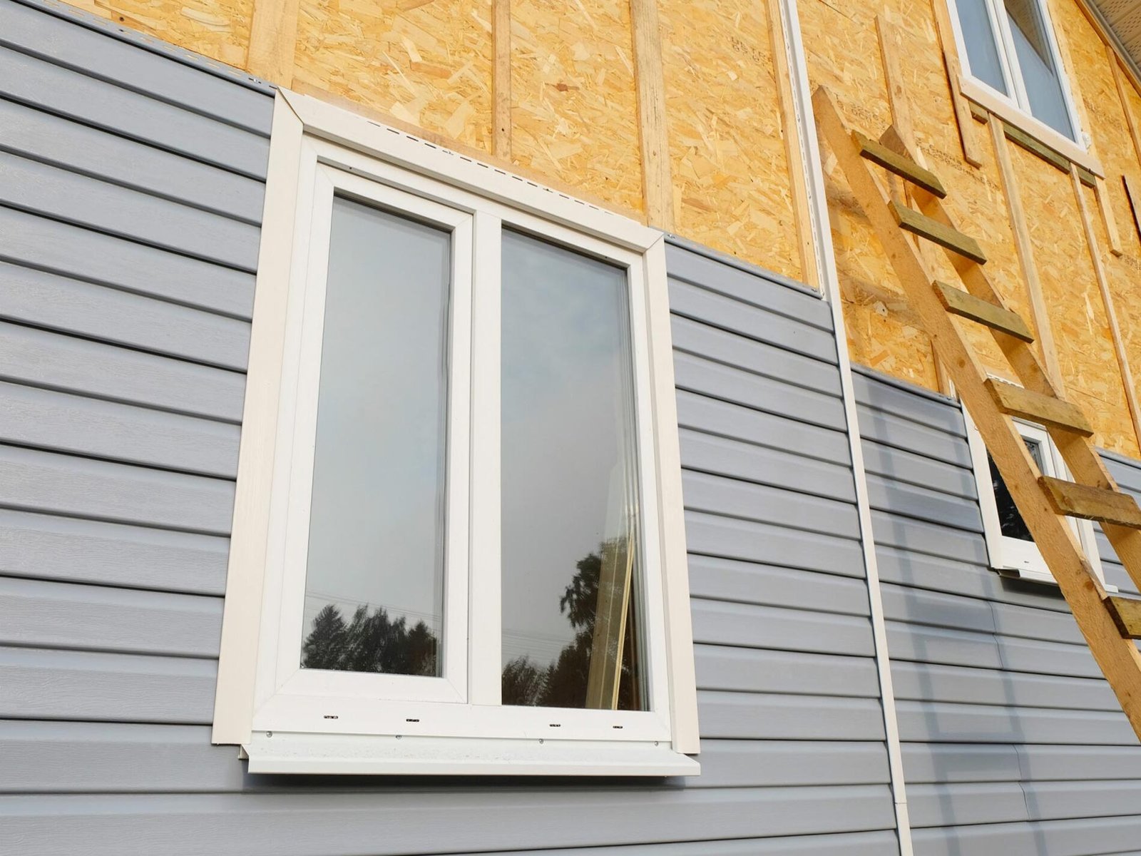 Vinyl siding installation on a residential property in Denver, CO